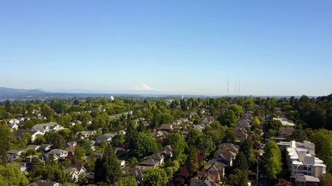 Mount Rainier over Seattle neighborhood - drone footage Stock Footage