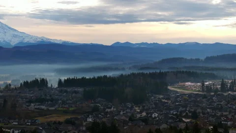 Mount Rainier Overlooking Misty Suburban Neighborhood Stock Footage 295174260
