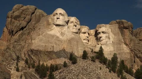 Mount Rushmore sun on faces deep blue sky.mp4 Stock Footage 10726333