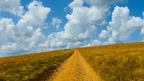 Mount slope with ground road at summer day time lapse scene Stock Footage 242503474
