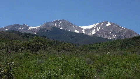 Mount Sopras mid summer, ￼snowcapped peaks Stock Footage 117464952