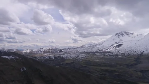 Mount St. Helens with white clouds on a sunny day Stock Footage 99086761
