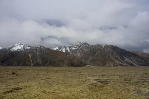 Mount Tasman view from dried field after winter season. Stock Photos