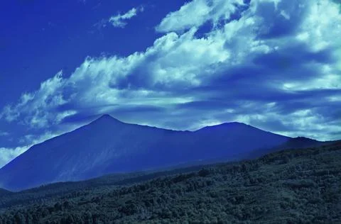 Mount Teide pushes the clouds so they don't spoil the landscape Stock Photos