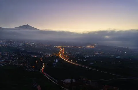 Mount Teide stands out from the clouds over the valley Stock Photos