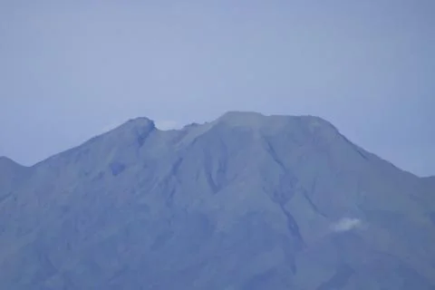 Mount Telemoyo Volcano Peak with Subtle Clouds and Clear Sky in Central Jav.. Stock Photos