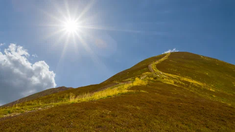 Mount top covered by grass at the summer sunny day Stock-Footage 252765425