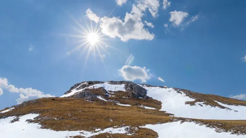 Mount top in a snow under a sparkle sun Stock Footage 333277258