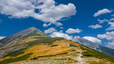 Mount top unde blue cloudy sky Stock Footage 319749382