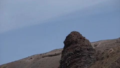 Mount Vesuvius summit zoom out from rock formation 4k Stock Footage 113994250