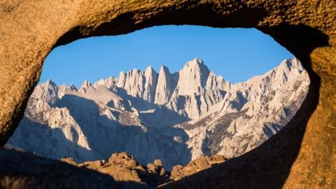 Mount Whitney summit through sandstone archway. Stock Photos