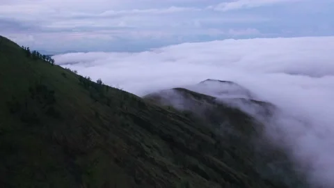 Mountain Above the Clouds Mount Batur Aerial Drone Video Stock Footage 143834117