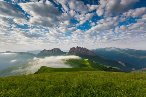 Mountain Achishboki under the ripples of clouds and fog. Stock Footage 52579513