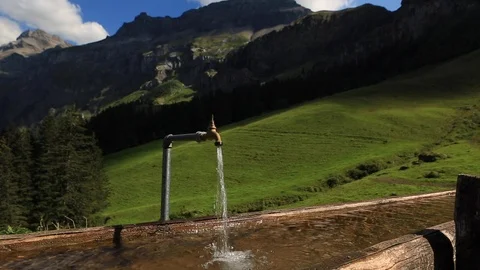 Mountain Alpine water for cows. Dolly shot 스톡 동영상 92804617