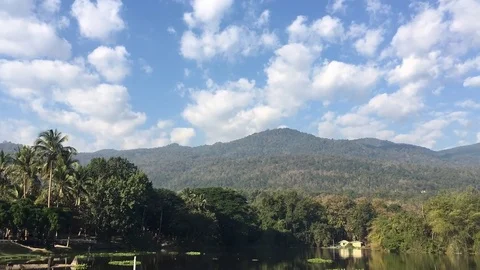 Mountain and forest lake with Clouds movement time lapse . Stock Footage 76331599
