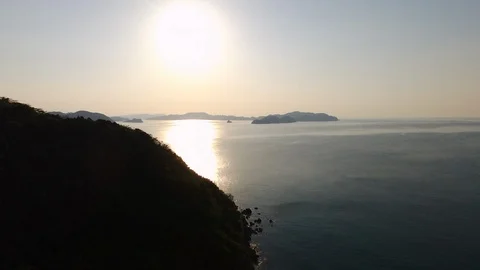The mountain and sun dawn to clear sea  view in rural area west Japan , aerial Stock Footage 108044585