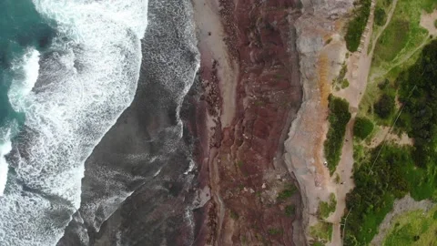 Mountain and waves panning up to show the whole mountain and golf coarse Stock Footage 135784652