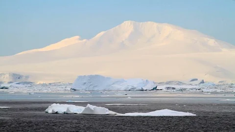 Mountain in Antarctica with floating ice Stock Footage 88286406