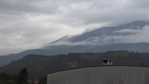 Mountain appearing from mist timelapse Stock Footage 158761253