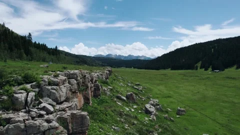 Mountain backdrop alongside a cliff in San Jose National Forest Stock Footage 276675736