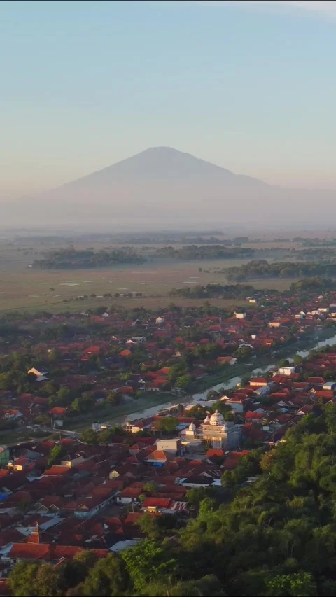 A mountain is in the background of a town 스톡 동영상 319161915
