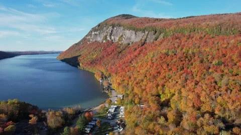 Mountain of Beautiful Fall Foliage Along Vermont Lake - Aerial Stock Footage 284249215