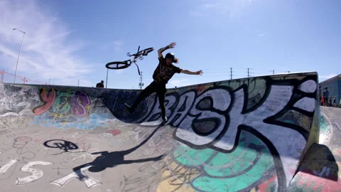 Mountain bike rider falling while hand plant over spine ramp Stock-Footage 157167956