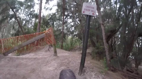 Mountain Bike Uphill root trail tight turn down hill trail Wheel View Stock-Footage 44188764