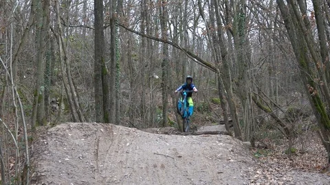 Mountain biker doing big jumps Stock Footage 122870314