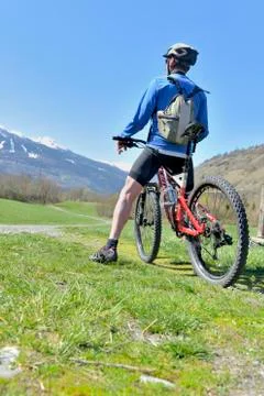 Mountain biker looking landscape Stock Photos