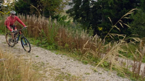 Mountain biker pushing hard on a mountain track. Stock Footage 63028763