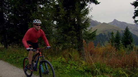Mountain biker pushing hard on a mountain track. Stock Footage 63029156