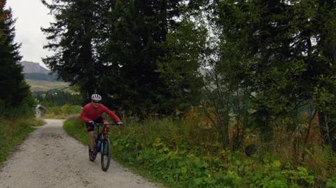 Mountain biker pushing hard on a mountain track. Stock Footage 63029522