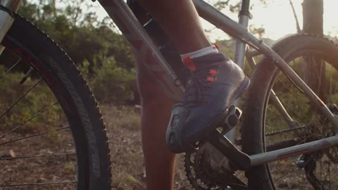 Mountain Biker putting his feet in the pedal in Slow Motion Stock Footage 260260339