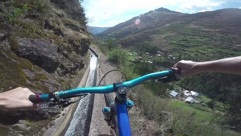 Mountain Biker Riding Close To The Edge Of A Big Cliff Stock Footage 79701341