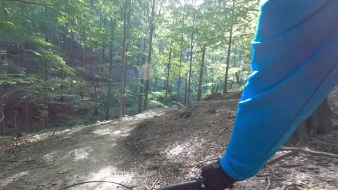 Mountain biker riding on flow single track trail in green forest. Stock Footage 138796833