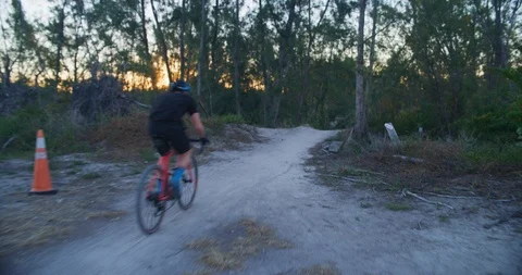 Mountain Biker riding through an offload trail Stock Footage 104225806