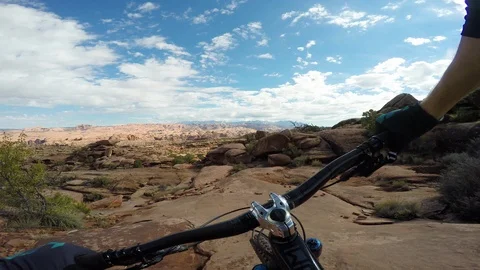 Mountain Biker Riding Through Unique Desert Landscape 스톡 동영상 114330534