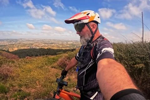 Mountain biker taking a selfie 스톡 사진