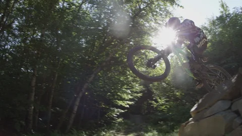 Mountain biker trails summer day jump Stock Footage 119033689