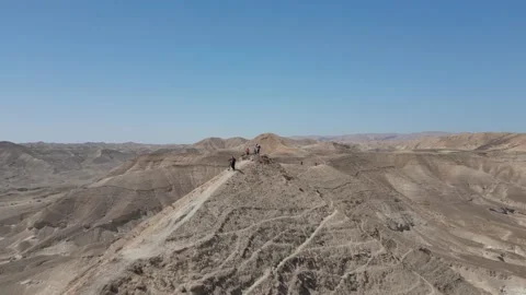 Mountain bikers along a sharp ridge in the desert, Aerial 스톡 동영상 239760516