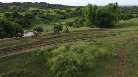 Mountain bikers on a muddy trail Stockbeeldmateriaal 246973070