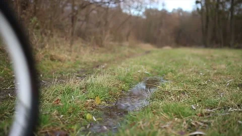 Mountain Bikers Through Puddles Stock Footage 87388033