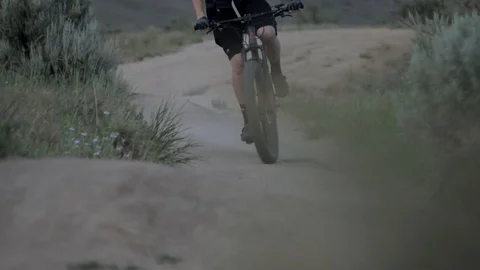 Mountain Biking Close Up of Bike Going Off Jump 스톡 동영상 101028500
