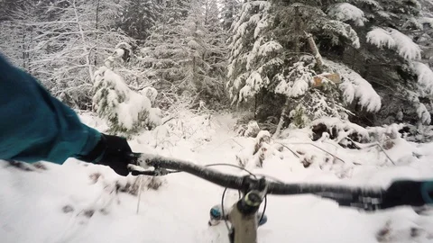 Mountain Biking Down A Snowy Trail In The Winter Stock-Footage 114534318