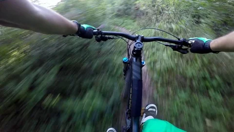 Mountain biking on forest trail in the sun Stock Footage 82337168