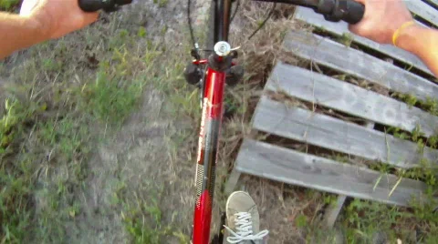 Mountain Biking Over Log Stock Footage 836802