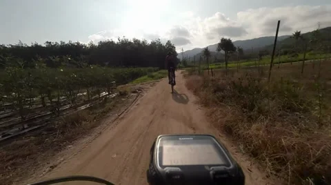 Mountain Biking in Remote Village Stock Footage 39338382