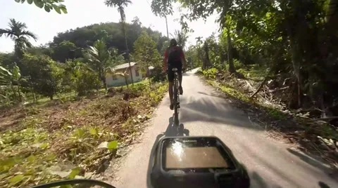 Mountain Biking in Remote Village Stock Footage 39338442