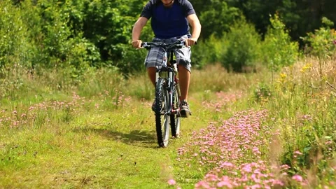 Mountain biking on a summer day 스톡 동영상 169190006
